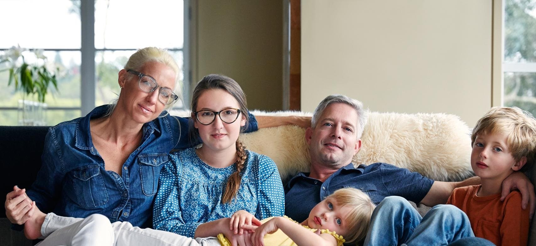 expat-family-on-couch-3-kids new